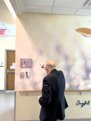 man with joyful memories wall